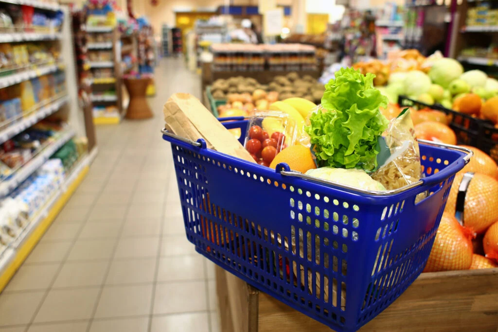 a shopping basket with food in it