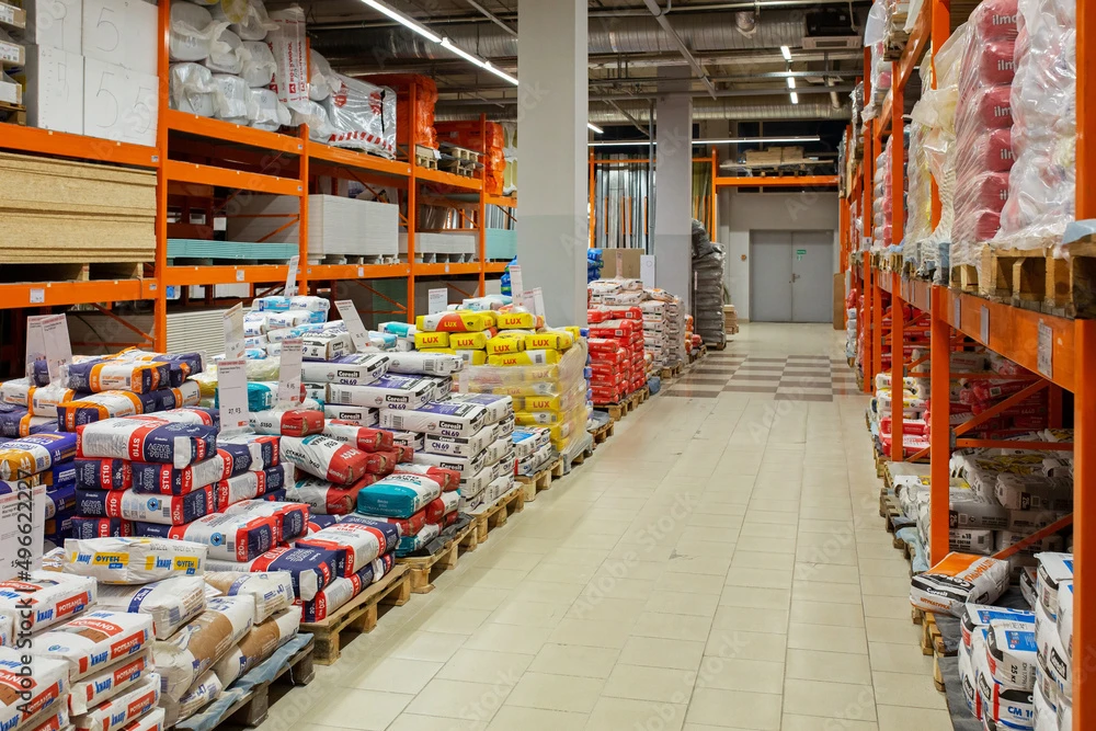 a warehouse with many stacks of materials